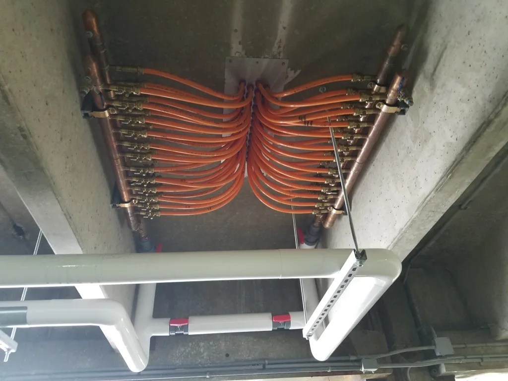 Hot Water Distribution Manifold Underneath Parking Deck